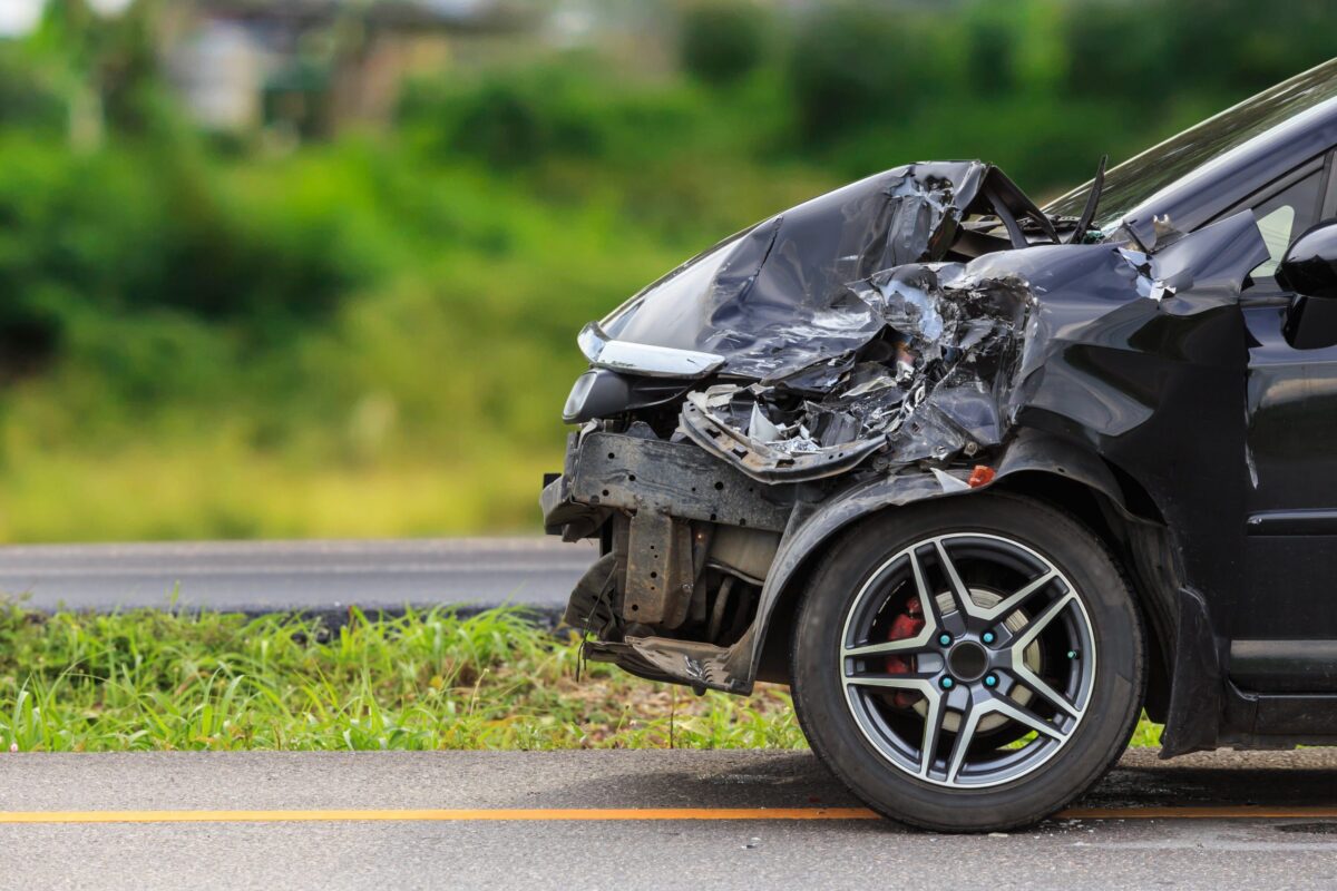 Front,Of,Black,Car,Get,Damaged,By,Accident,On,The